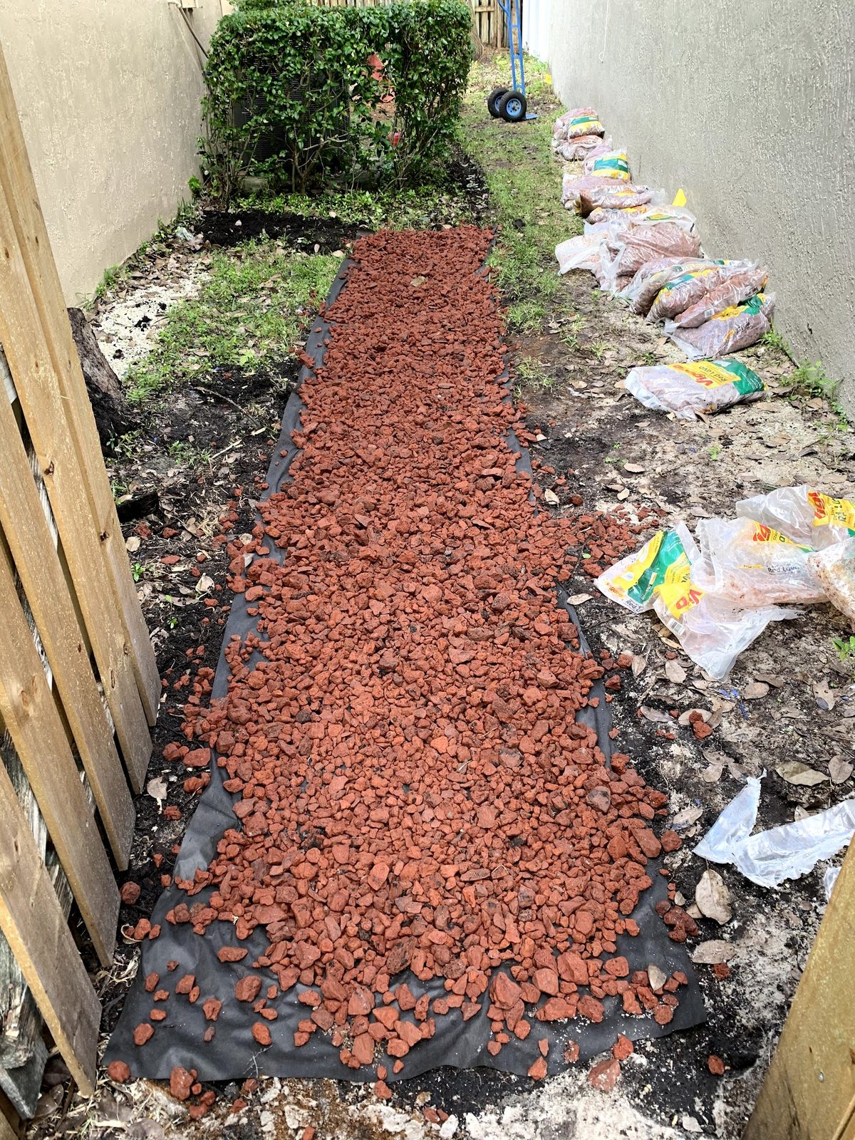 Fresh red mulch path after cleanup